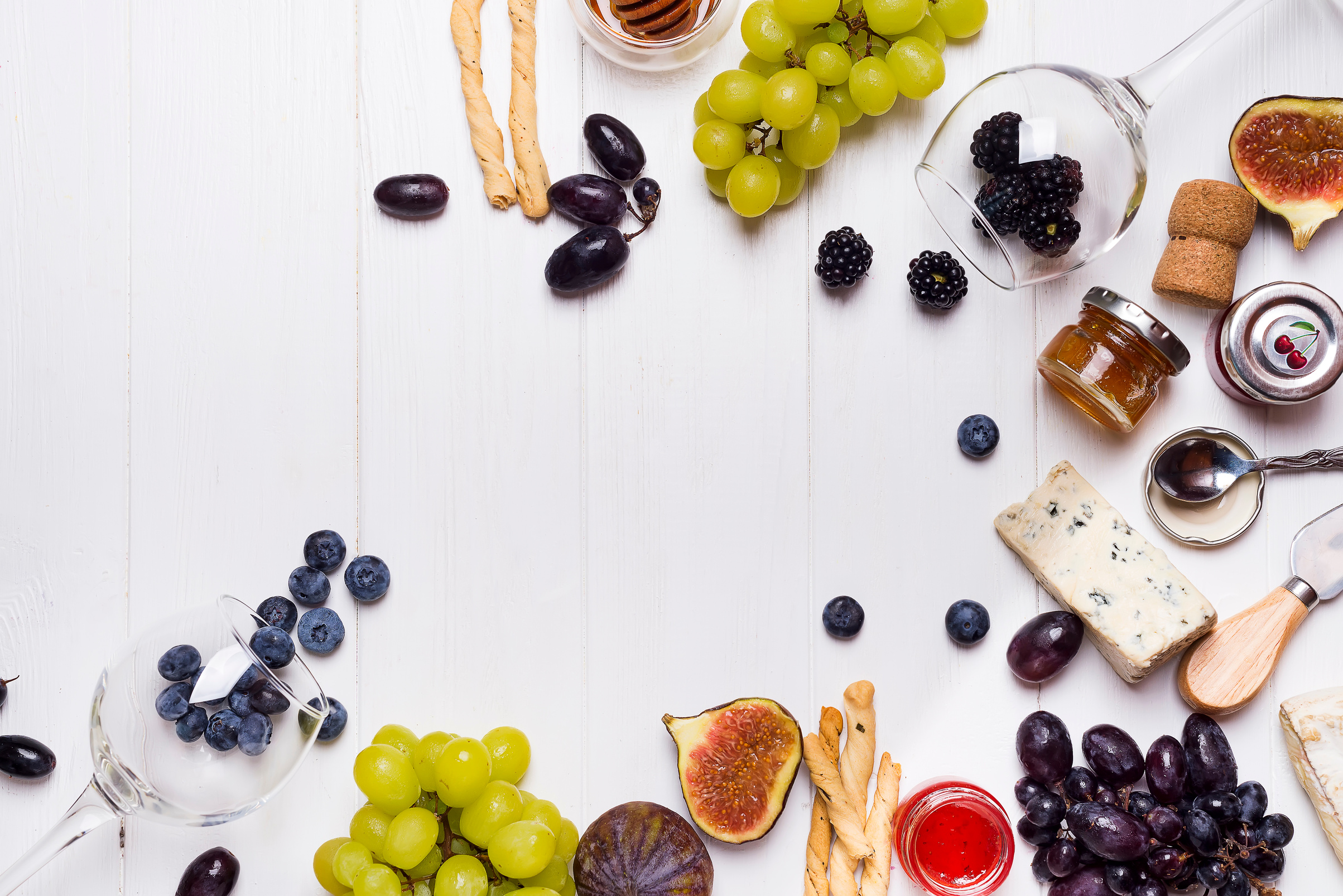 Assorted Winery Fruits and Cheese on White Wooden Background